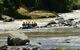 raft travelling along a flat section of the Pacuare River