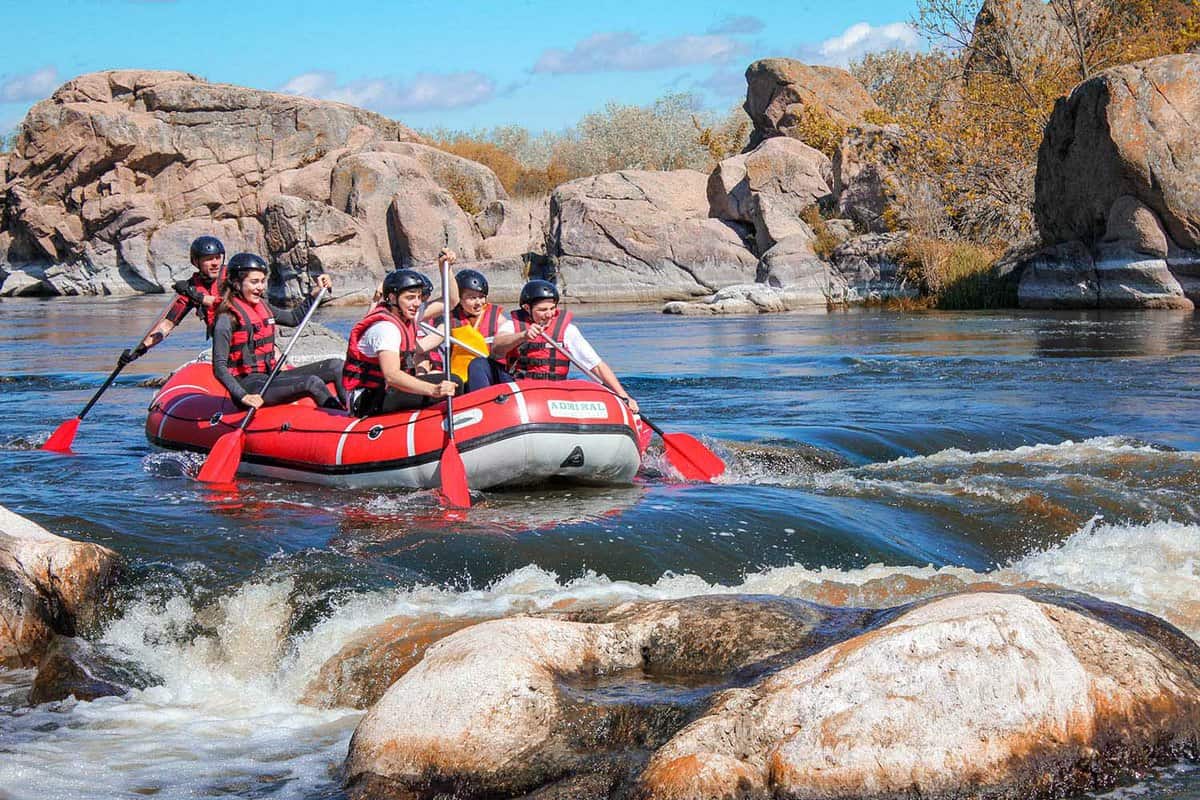 raft with 6 crew approaching rapids