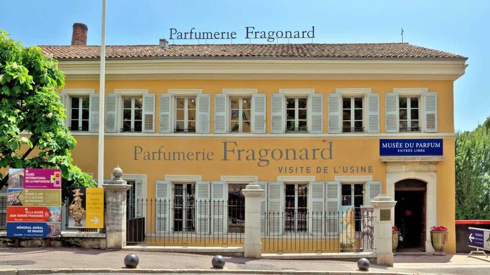 Exterior of the Fragonard factory, a traditional French house with white shutters