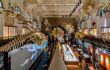 Interior of oceanographic museum with marine life skeletons hanging from the ceiling