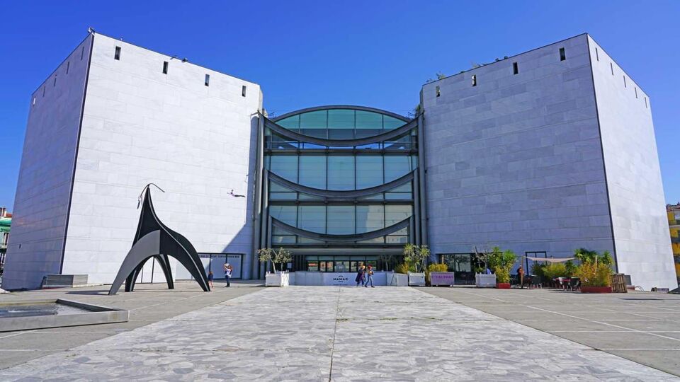 Large, concrete and glass exterior of modern art museum