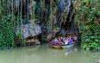 Tourists in a boat are leaving Cueva del Indio cave in National Park Vinales, Cuba