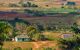 Cuban tobacco region, tropical sunny farmland area at sunset. Panoramic view over beautiful hills, hilly landscape with mogotes in Vinales Valley where the best tobacco leaves for cigars are produced