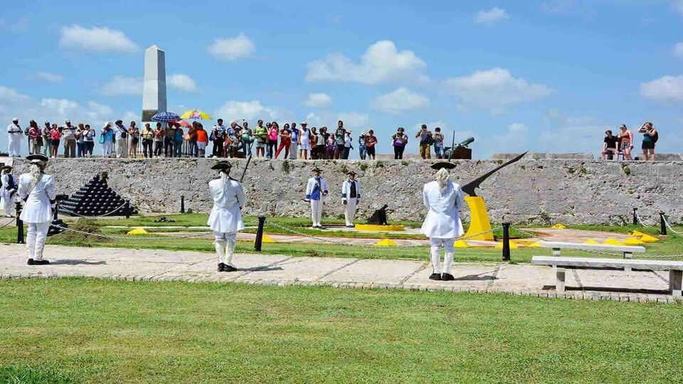 Tourists gather on the fortress wall to watch the reenactment.