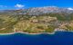 Vineyards on mountain slope into coast