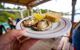 plates of oysters being carried out