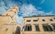 Wall of Franciscan church and monastery with tower bell in old town Dubrovnik, Croatia