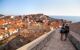 Couple walk atop city walls