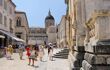 Unidentified tourists on the street of the old town of Dubrovnik, Croatia. Dubrovnik is a UNESCO World Heritage site