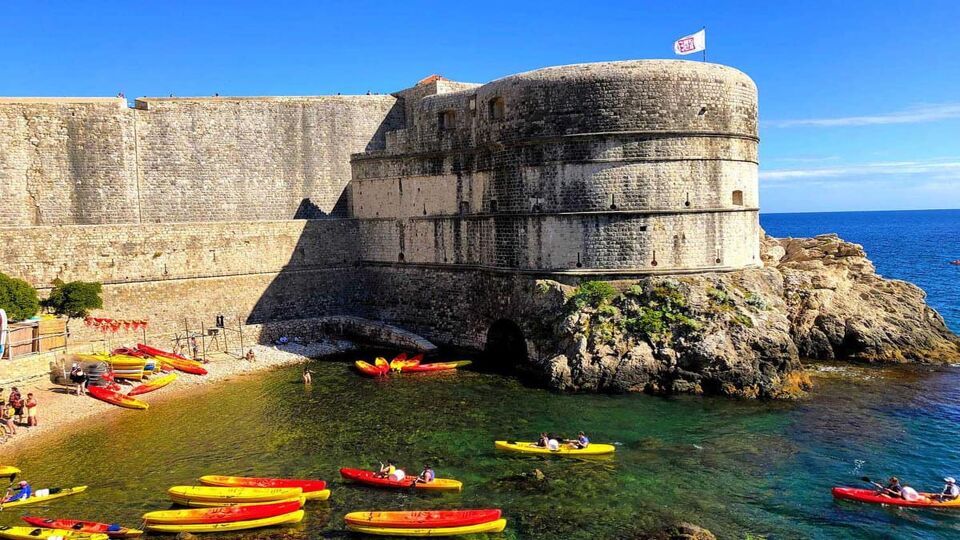 Kayaks in the Water by Dubrovnik Outer City Wall Fortifications