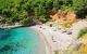 sandy beach with azure blue sea