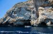 Boat with tourists heading to Blue cave on Bisevo island, Croatia.