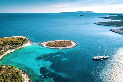 Aerial view of Paklinski Islands in Hvar, Croatia. Turquise water bays with luxury yachts and sailing boats. Toned image.