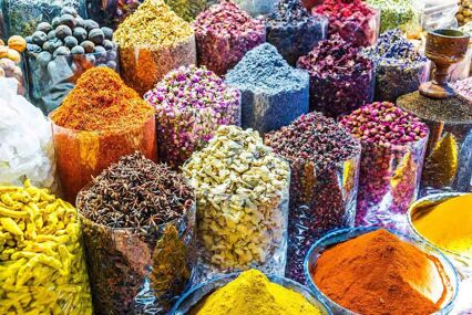 Variety of spices and herbs on the arab street market stall. Dubai Spice Souk, United Arab Emirates.