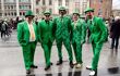 Group of five men in green suits on the streets of Dublin on St Patrick's Day