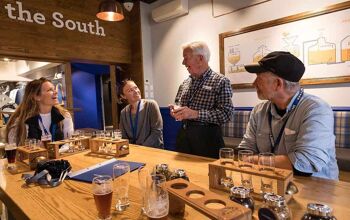 Group beer tasting led by host at Speights' Brewery in Dunedin