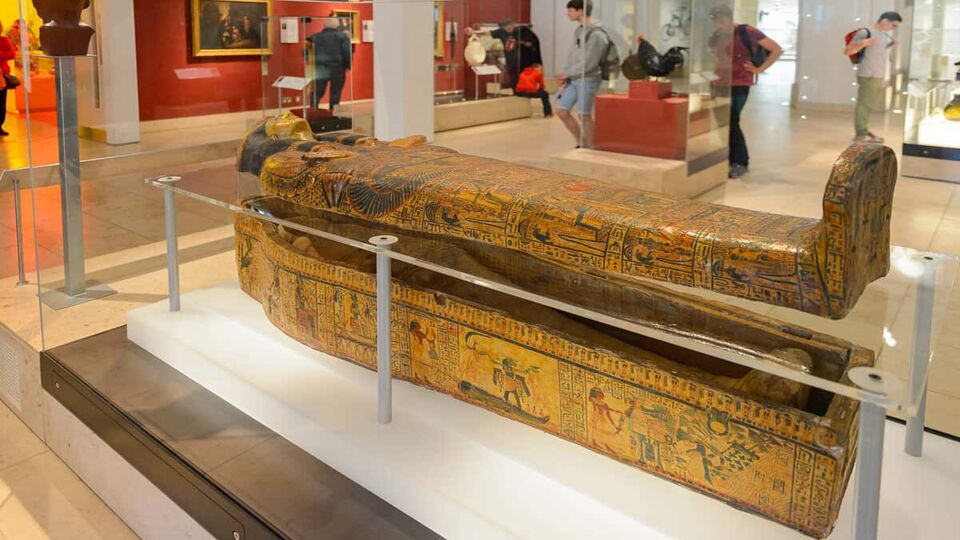 Egyptian sarcophagus in glass display case