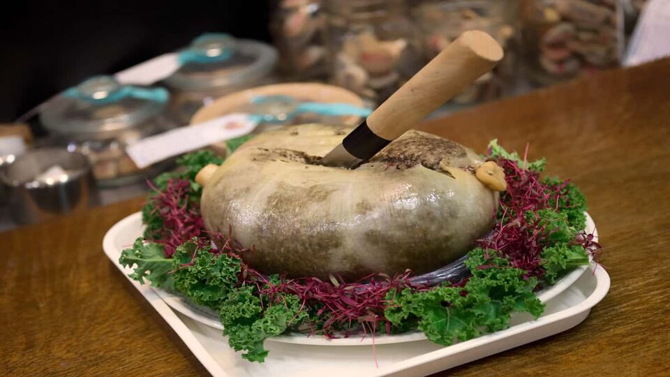 Massive Haggis food dish with knife stuck in it.