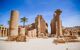 Ruined columns around a central square in the Karnak Temple