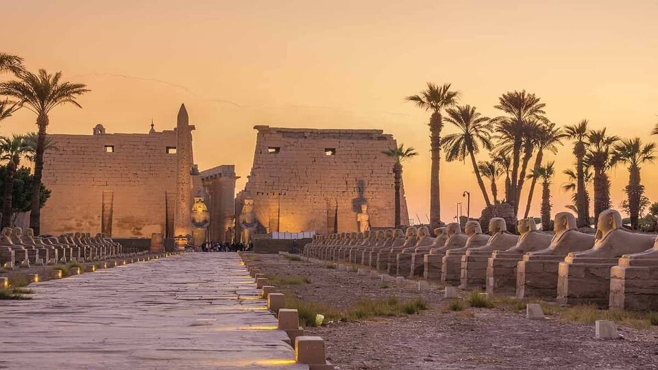 Temple of Luxor at sunset with avenue of sphinxes