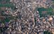 looking down from the balloon into a village