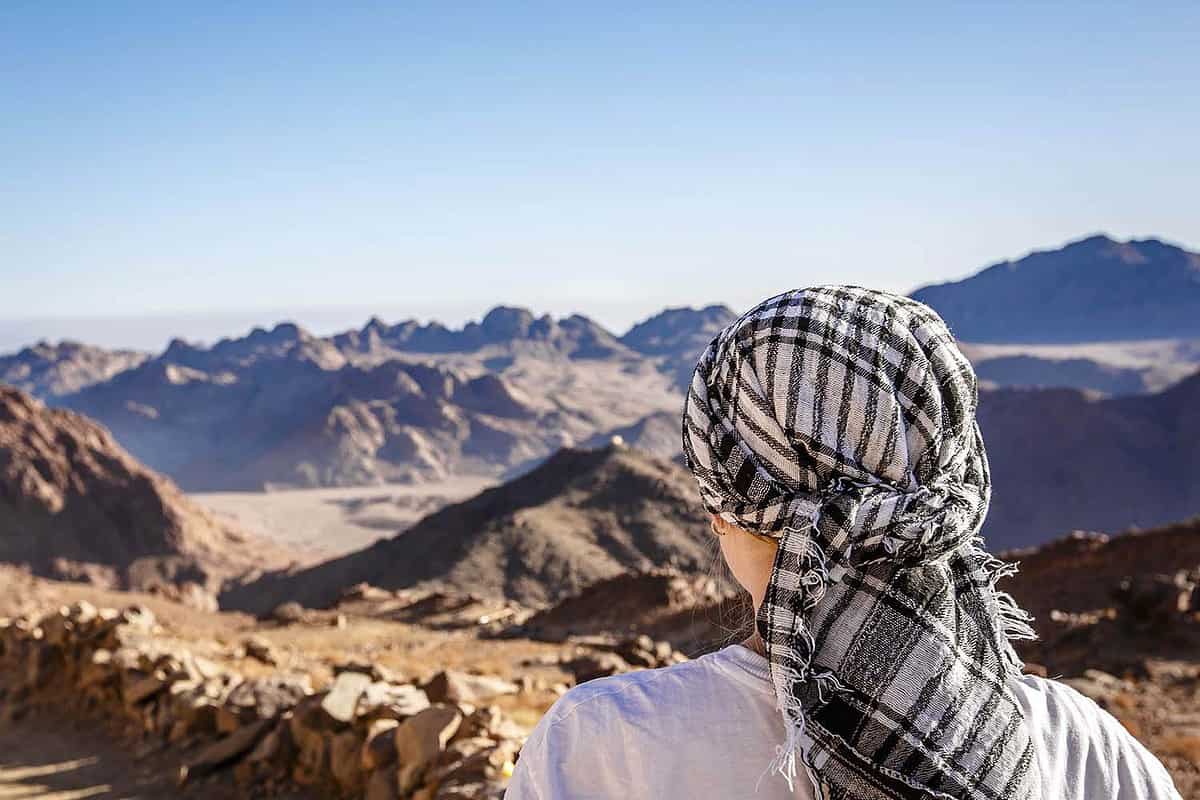 Muslim man in traditional Keffiyeh on top of Mount Moussa in South Sinai, Egypt