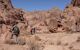 Local bedouin and hikers on the hiking trail in the Southern Sinai. Panoramic view over the trail on surrounding mountains and valleys.