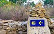 Shell sign and arrow of ancient pilgrim routes The Way of Saint James(El Camino de Santiago).