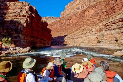 Group on a raft staring at next set of rapids in the Grand Canyon
