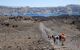 Tourists hiking on the volcanic island Nea Kameni