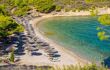 Amazing small beach on idyllic greek island Spetses. awe blue water of Aegean Sea ( or Mediterranean sea ) . Soom sunset