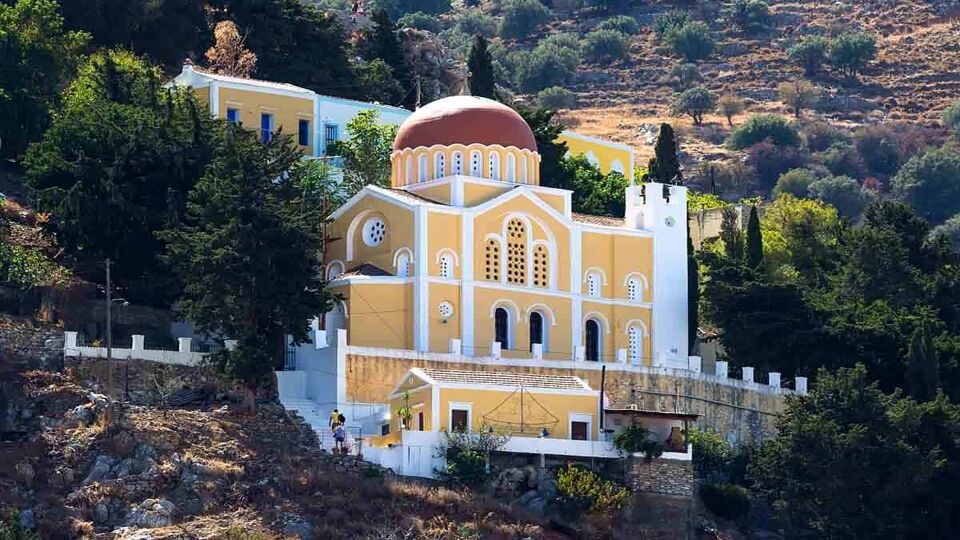 Church on the slope of the island of Symi. Greece