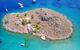 Aerial birds eye view photo taken by drone of famous tropical beach of Agia Marina, Symi island, Dodecanese, Greece