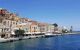 Greek Island Symi bay with characteristic symi buildings near the sea