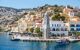 Looking down onto boats moored in Yialos harbour on Symi island, Greece. Symi is easy and most popular destination for day tripping from Rhodes island.