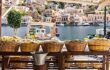 baskets with traditional sponges on the waterfront in Gialos, also spelt Yialos, the main harbour of the island.