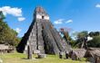 Large stone Mayan pyramid temple in a field