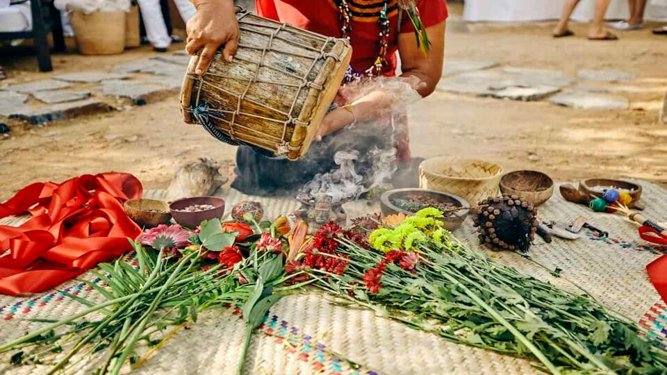 Local shaman and collection of items to be used in the ceremony