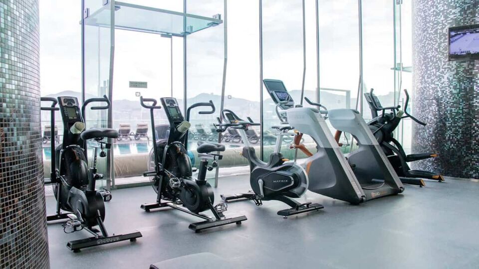 Hotel gym area with various types of equipment