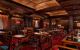 Warmly lit, wood panelled dining area