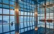 Large indoor swimming pool with views out onto the harbour