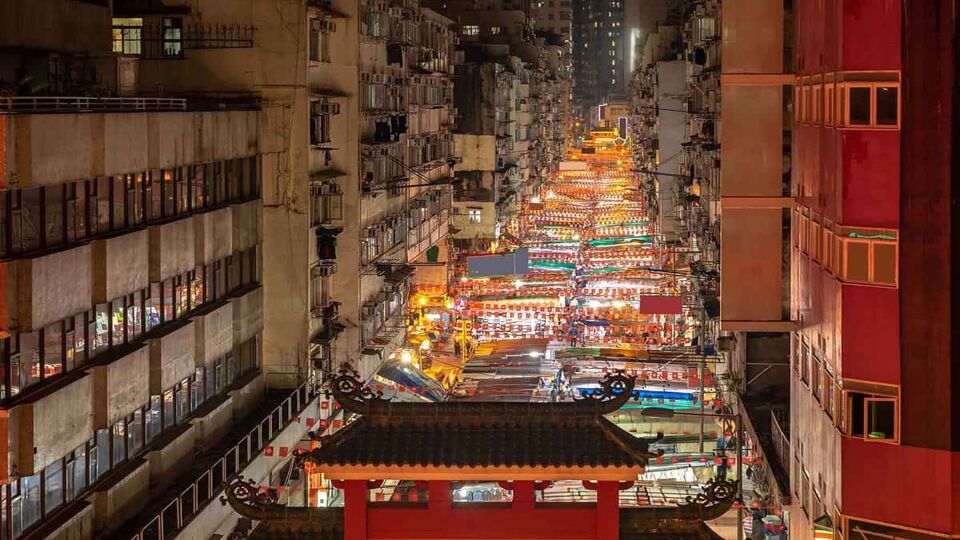 The market from above, showing the buildings on either side, with rows of red flags