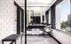 Bathroom with polished mirrors, a view, and stylish tiling