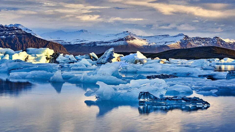 Midnight sun over Jokulsarlon iceberg available as Framed Prints