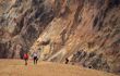 several hikers walking around the hills at the Landmannalaugar National Park