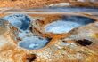 Namafjall Hverir geothermal area in Iceland. Boiling mud pots surrounded by sulfur crystals, natural travel background, tourist attraction