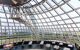 visitors inside glass dome on Observation Deck of Perlan Museum in Reykjavik city in evening. The Perlan Museum of Wonders of Iceland was opened in 2017