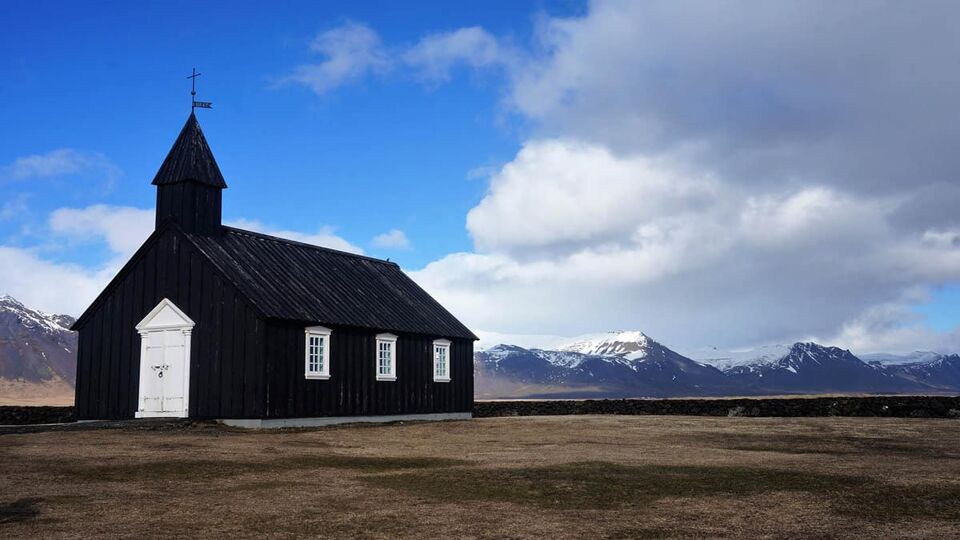 A small black wooden church on the Snaefellsnes Peninsula