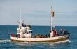 Whale watching boat with passengers going out the Husavik for waching the Humpback Whale. Iceland