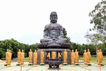oversized bronze buddha at the Chen Tien Buddhist Temple in iguazu Falls